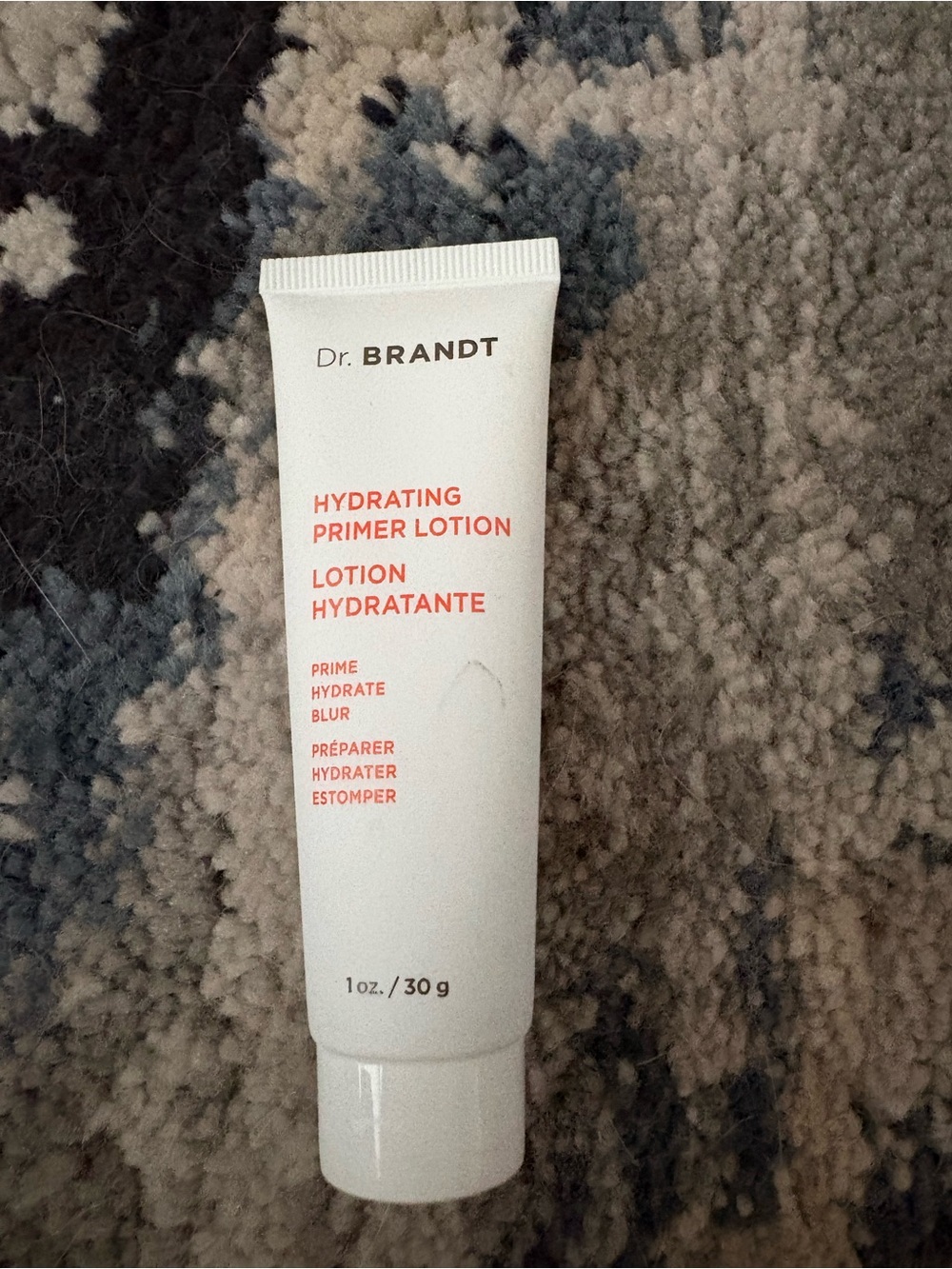 Dr. Brandt Hydrating Primer Lotion — White with Coral Text